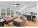 Inviting living room with lots of natural light and an open floor plan to kitchen and dining areas at 452 Sun Colony Blvd., Longs, SC 29568