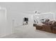 Spacious living room boasts plush carpet, a comfortable couch, and a ceiling fan at 452 Sun Colony Blvd., Longs, SC 29568