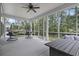 Screened-in porch offering comfortable seating and backyard views at 452 Sun Colony Blvd., Longs, SC 29568