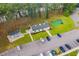 Aerial shot showcasing the community clubhouse with mini golf, lush trees, and a large parking lot at 453 Red River Ct. # 38 I, Myrtle Beach, SC 29579