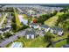 Bird's eye view of condominium buildings overlooking a lake, golf course, and residential neighborhood at 453 Red River Ct. # 38 I, Myrtle Beach, SC 29579