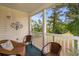 Charming balcony with comfortable chairs, tranquil views, and decorative wall art at 453 Red River Ct. # 38 I, Myrtle Beach, SC 29579