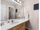 Bright bathroom with a large mirror, vanity, and coastal-themed wall art at 453 Red River Ct. # 38 I, Myrtle Beach, SC 29579