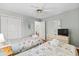 Bedroom area with 2 beds, tv, and a view into the living and dining areas at 453 Red River Ct. # 38 I, Myrtle Beach, SC 29579