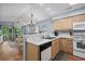 Open kitchen with white countertops, wood cabinets and pass through to living area at 453 Red River Ct. # 38 I, Myrtle Beach, SC 29579
