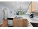 Modern kitchen with light wood cabinets and open view to the dining and living area at 453 Red River Ct. # 38 I, Myrtle Beach, SC 29579