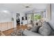 Living room area with wood floors, ceiling fan, stylish furniture and a sliding glass door to the balcony at 453 Red River Ct. # 38 I, Myrtle Beach, SC 29579
