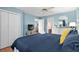 Bright main bedroom featuring a comfortable blue comforter, ceiling fan, and closet at 453 Red River Ct. # 38 I, Myrtle Beach, SC 29579