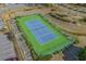 Aerial view of blue fenced tennis court with green outdoor surface at River Oaks Golf and Tennis Resort, Myrtle Beach SC at 453 Red River Ct. # 38 I, Myrtle Beach, SC 29579
