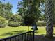 Beautiful landscaped yard with a birdhouse and palm tree at 5001 Little River Rd. # E-117-119, Myrtle Beach, SC 29577