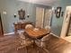 Dining room with wood table and chairs and a buffet at 5001 Little River Rd. # E-117-119, Myrtle Beach, SC 29577