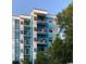 Modern condo building featuring balconies, white trim and painted blue accents at 5001 Little River Rd. # E-117-119, Myrtle Beach, SC 29577