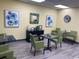 Inviting lobby area featuring contemporary chairs, tables, and artwork at 5001 Little River Rd. # E-117-119, Myrtle Beach, SC 29577