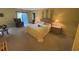 Carpeted main bedroom with an accent wall, and access to the outdoor patio at 5001 Little River Rd. # E-117-119, Myrtle Beach, SC 29577