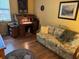 Home office with a writing desk, comfortable sitting area with sofa, enhancing productivity and comfort at 5001 Little River Rd. # E-117-119, Myrtle Beach, SC 29577