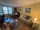 Functional home office featuring a writing desk, sofa and decor for enhanced comfort and productivity at 5001 Little River Rd. # E-117-119, Myrtle Beach, SC 29577