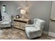 Comfortable sitting area featuring chairs and a table with coastal themed decor at 5001 Little River Rd. # E-117-119, Myrtle Beach, SC 29577