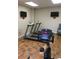 Well-equipped workout room with treadmills and stationary bike on attractive wood floors at 5001 Little River Rd. # E-117-119, Myrtle Beach, SC 29577