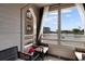 Overlooking the water, the outdoor balcony provides the perfect spot to relax and unwind in comfortable seating at 501 Maison Dr. # F14, Myrtle Beach, SC 29572