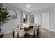 Dining space with a modern table set and a large window providing natural light and outside views at 501 Maison Dr. # F14, Myrtle Beach, SC 29572