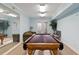 Interior game room featuring a pool table, sofa and decorative greenery at 501 Maison Dr. # F14, Myrtle Beach, SC 29572