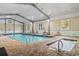 Indoor pool and hot tub area features lounge chairs and natural lighting at 501 Maison Dr. # F14, Myrtle Beach, SC 29572