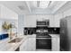 Stylish kitchen with modern appliances, sleek countertops, and elegant fixtures at 501 Maison Dr. # F14, Myrtle Beach, SC 29572