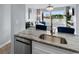 Kitchen with stone countertops, stainless steel appliances, and a view of the living space at 501 Maison Dr. # F14, Myrtle Beach, SC 29572