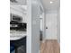 Kitchen and hallway featuring modern appliances, stylish countertops, and an open layout at 501 Maison Dr. # F14, Myrtle Beach, SC 29572