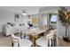 Open-concept living area featuring modern furnishings, stylish decor, and a sliding glass door to a private balcony at 501 Maison Dr. # F14, Myrtle Beach, SC 29572
