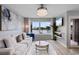 Elegant living area with a stylish sofa, contemporary decor, and a large window offering stunning views at 501 Maison Dr. # F14, Myrtle Beach, SC 29572