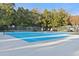 Outdoor tennis and basketball court surrounded by lush trees at 501 Maison Dr. # F14, Myrtle Beach, SC 29572