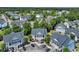 Aerial view of a condominium complex with mature trees and ample parking at 5038 Belleglen Ct. # 202, Myrtle Beach, SC 29579