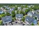 Aerial view of a condominium complex with mature trees and ample parking at 5038 Belleglen Ct. # 202, Myrtle Beach, SC 29579