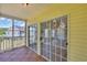Cozy balcony featuring tiled flooring and glass sliding doors for a seamless indoor-outdoor flow at 5038 Belleglen Ct. # 202, Myrtle Beach, SC 29579