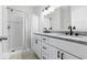 Modern bathroom featuring double sinks, granite countertops, and a tiled shower with a curtain at 5038 Belleglen Ct. # 202, Myrtle Beach, SC 29579