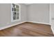 Bedroom with window and neutral wall color with beautiful hardwood flooring at 5038 Belleglen Ct. # 202, Myrtle Beach, SC 29579