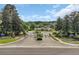 Gated community entrance with lush landscaping, fountain, and view of the clubhouse at 5038 Belleglen Ct. # 202, Myrtle Beach, SC 29579