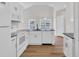 Bright kitchen with white cabinets, granite countertops, and modern appliances at 5038 Belleglen Ct. # 202, Myrtle Beach, SC 29579