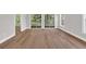 Bright living room featuring wood-look flooring and sliding glass doors at 5038 Belleglen Ct. # 202, Myrtle Beach, SC 29579