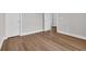 Living room with dark hardwood flooring with white base trim at 5038 Belleglen Ct. # 202, Myrtle Beach, SC 29579