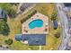Aerial shot of a community pool with lounge chairs, tables, and well-maintained landscaping at 5038 Belleglen Ct. # 202, Myrtle Beach, SC 29579