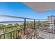 Relaxing balcony with views of the Atlantic Ocean and beach palm trees at 504 N Ocean Blvd. N # 309, Myrtle Beach, SC 29577