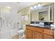 Well-maintained bathroom boasts a shower-tub combo, vanity with granite counter, and ample lighting at 504 N Ocean Blvd. N # 309, Myrtle Beach, SC 29577