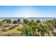 Beach view from building overlooking ocean, palm trees, and lounge seating at 504 N Ocean Blvd. N # 309, Myrtle Beach, SC 29577