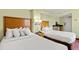 Comfortable hotel bedroom featuring two double beds with plush white bedding at 504 N Ocean Blvd. N # 309, Myrtle Beach, SC 29577