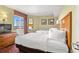 Bright bedroom featuring 2 beds, dresser with TV, balcony access and artwork at 504 N Ocean Blvd. N # 309, Myrtle Beach, SC 29577