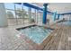 Indoor hot tub area with brick flooring, lounge chairs, and views of the ocean at 504 N Ocean Blvd. N # 309, Myrtle Beach, SC 29577