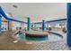 Indoor lazy river pool with seating, tile flooring, and views of the outside at 504 N Ocean Blvd. N # 309, Myrtle Beach, SC 29577