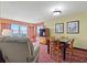 Comfortable living room featuring a dining area with ocean views and a flat screen television at 504 N Ocean Blvd. N # 309, Myrtle Beach, SC 29577